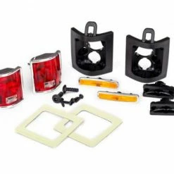 Traxxas Tail Lights Left Right (assembled)/ Tail Light Retainers Left Right/ Side Marker Lights (assembled) (2)/ Side Marker Retainers (2)/ Mounting Tape (2)/ 1.6x5 BCS (self-tapping) (4)/ 2.6x8 BCS (2) (fits 8130 Body)
